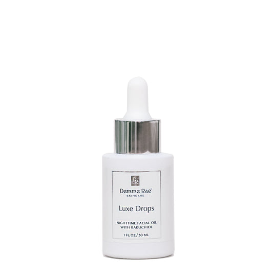 White skincare dropper bottle labeled 'Luxe Drops' on a white background
